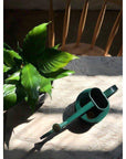 haws green watering can with piece lilly